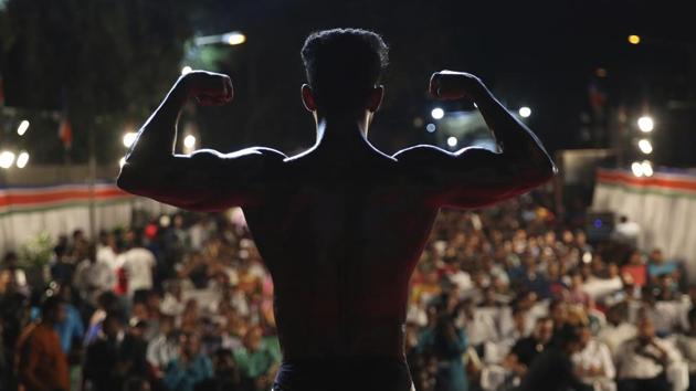 A body builder displays his muscles during the Mumbai Bodybuilding competition in Mumbai, Maharashtra. (Rafiq Maqbool / AP) A body builder displays his muscles during the Mumbai Bodybuilding competition in Mumbai, Maharashtra. (Rafiq Maqbool / AP)