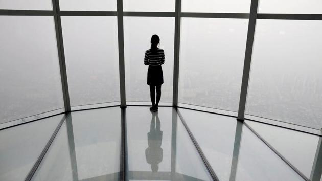 A woman looks at a view of Seoul shrouded by fine dust during a polluted day in Seoul, South Korea. (Kim Hong-Ji / REUTERS) 