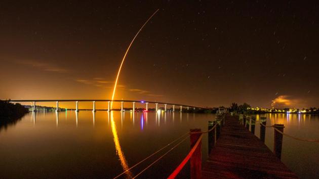 A SpaceX Falcon 9 rocket, carrying the Crew Dragon spacecraft, lifts off on an uncrewed test flight to the International Space Station from the Kennedy Space Center as viewed in Vero Beach, Florida. (Joe Rimkus Jr. / REUTERS) 