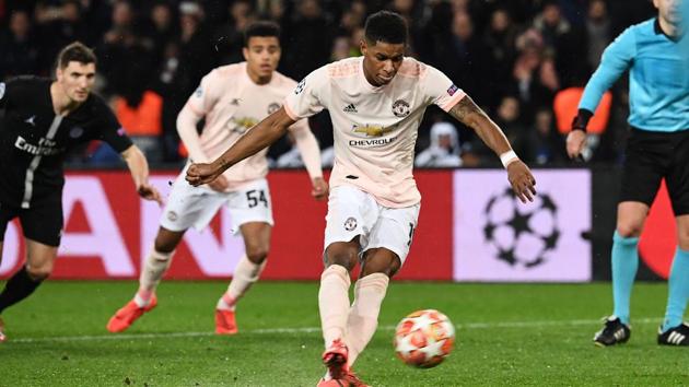 Manchester United's Marcus Rashford scores a penalty during the UEFA Champions League round of 16 second-leg match against Paris Saint-Germain (PSG). (AFP) Manchester United's Marcus Rashford scores a penalty during the UEFA Champions League round of 16 second-leg match against Paris Saint-Germain (PSG). (AFP)