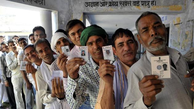 Uchana Kallan villagers wait to cast their votes during a bypoll .(HT file photo)