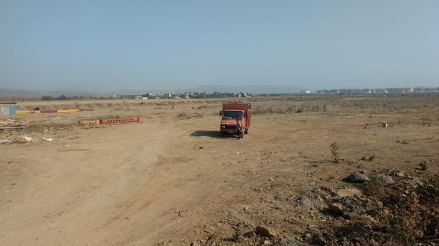 The land at Dastan Phata is being levelled for construction work.(HT PHOTO)