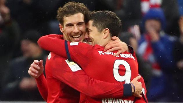 Bayern Munich's Robert Lewandowski celebrates scoring their sixth goal with Leon Goretzka.(REUTERS)