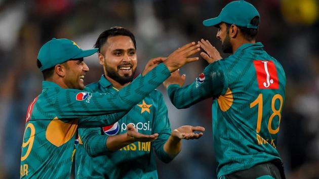 Pakistan's Shadab Khan (back) celebrates after getting the wicket of South Africa's David Miller. (AFP) Pakistan's Shadab Khan (back) celebrates after getting the wicket of South Africa's David Miller. (AFP)