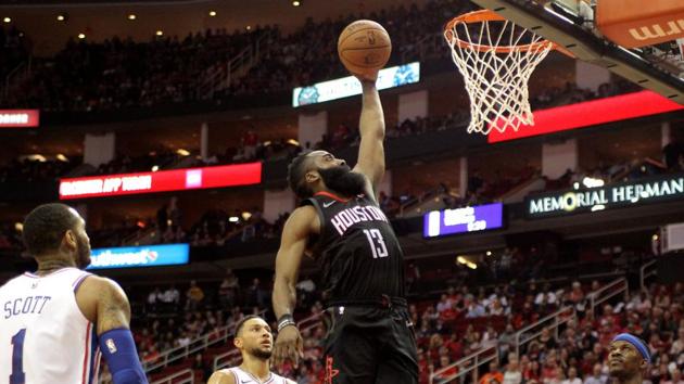 Houston Rockets guard James Harden (13) elevates for a dunk against the Philadelphia 76ers.(Reuters)