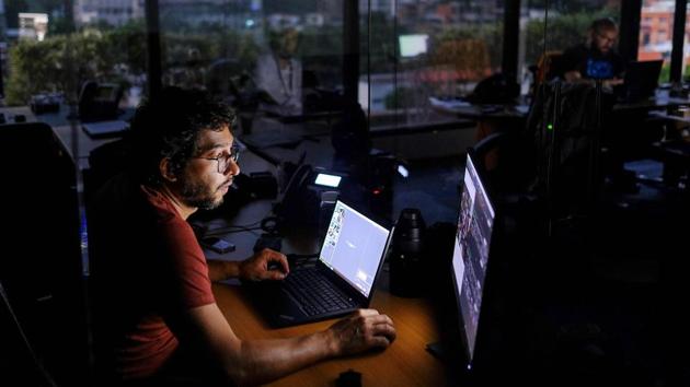A photojournalist works during a power cut in Caracas. Citizens reported blackouts from the Andes to the Caribbean coast, in about 19 of 23 states. The socialist government blamed an attack on the nation’s biggest and most closely guarded hydroelectric plant, but other sources of electricity failed to pick up the slack, including thermoelectric units in the country’s centre and west. (Matias Delacroix / AFP) A photojournalist works during a power cut in Caracas. Citizens reported blackouts from the Andes to the Caribbean coast, in about 19 of 23 states. The socialist government blamed an attack on the nation’s biggest and most closely guarded hydroelectric plant, but other sources of electricity failed to pick up the slack, including thermoelectric units in the country’s centre and west. (Matias Delacroix / AFP)