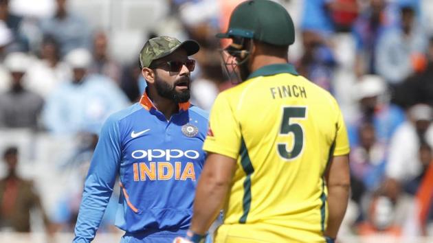 Virat Kohli, left, interacts with teammates before asking for a review for the wicket of Australia's captain Aaron Finch. (AP) Virat Kohli, left, interacts with teammates before asking for a review for the wicket of Australia's captain Aaron Finch. (AP)