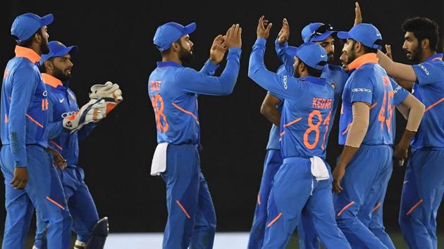 India cricketers celebrate the wicket of Australia cricketer Usman Khawaja. (AFP) India cricketers celebrate the wicket of Australia cricketer Usman Khawaja. (AFP)