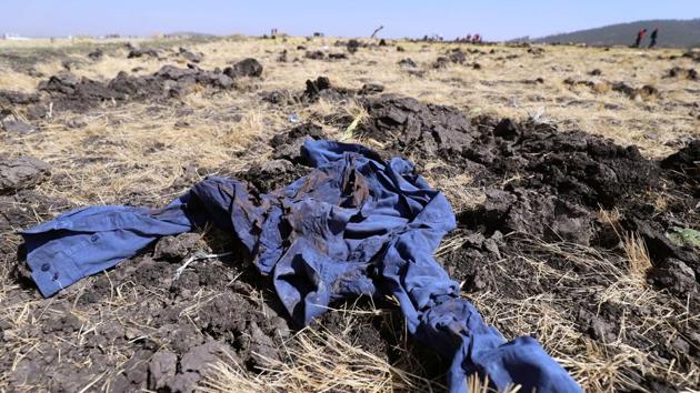A shirt is seen at the scene of the Ethiopian Airlines Flight ET 302 plane crash, near the town of Bishoftu, southeast of Addis Ababa, Ethiopia on March 11. (REUTERS) A shirt is seen at the scene of the Ethiopian Airlines Flight ET 302 plane crash, near the town of Bishoftu, southeast of Addis Ababa, Ethiopia on March 11. (REUTERS)