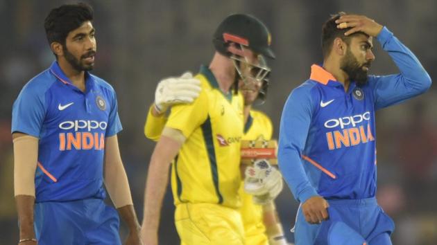 Virat Kohli along with teammates walk off the field after losing 4th ODI against Australia in Mohali. (PTI) Virat Kohli along with teammates walk off the field after losing 4th ODI against Australia in Mohali. (PTI)
