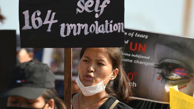 An exiled Tibetan activist holds a placard during in Chennai on March 10, 2019. “Sixty years we’ve been in exile. Still, our struggle is young and fresh and strong, so we can give a message to China that until Tibetans remain, our struggle will never end,” Tsering in Dharamsala said. (Arun Sankar / AFP) 