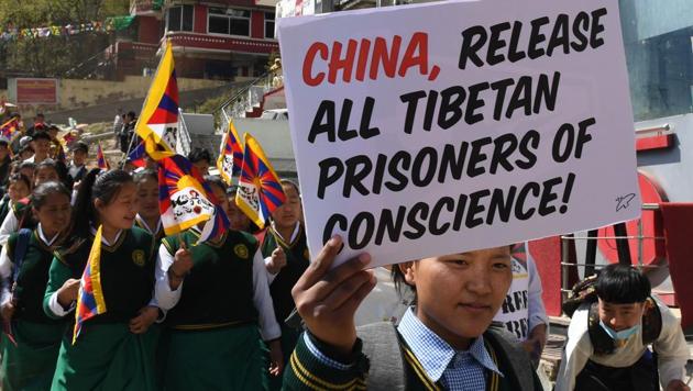 School children march holding placards and flags in McLeod Ganj, Himachal Pradesh. Supporters of the 83-year-old peace icon chanted and prayed at the Buddhist shrine in mountainous Dharamsala, where the Dalai Lama established a government-in-exile after fleeing a deadly Chinese crackdown in Tibet in 1959. (Money Sharma / AFP) 