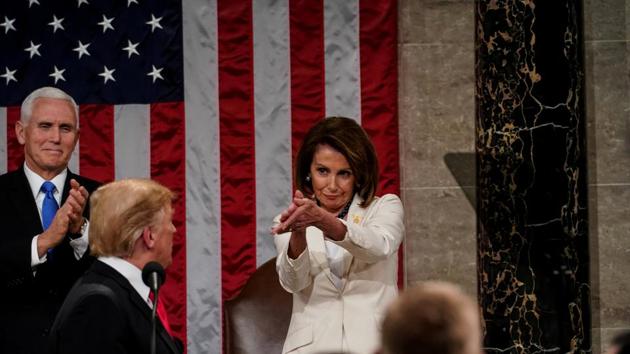 US president Donald Trump after the State of the Union address, with Vice President Mike Pence and Speaker of the House Nancy Pelosi, at the Capitol in Washington on February 5.(REUTERS)