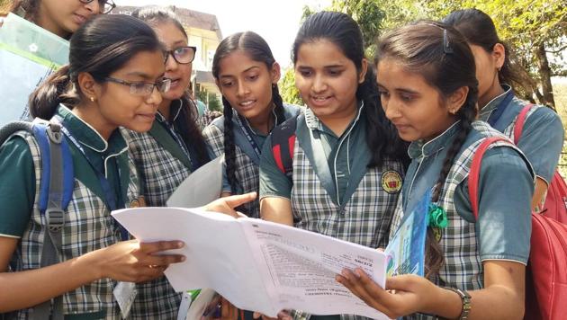 Students discussing question paper after writing exam of Chemistry CBSE class12th at Jawahar Lal Nehru H S school in Bhopal, India, on Tuesday,(Mujeeb Faruqui/HT Photo)