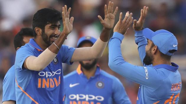 Virat Kohli, right, and Jasprit Bumrah celebrate the dismissal of Australia's Shaun Marsh. (AP) Virat Kohli, right, and Jasprit Bumrah celebrate the dismissal of Australia's Shaun Marsh. (AP)