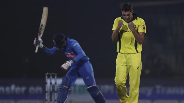 Australia's Pat Cummins celebrates the wicket of India's Kedar Jadhav. (AP)