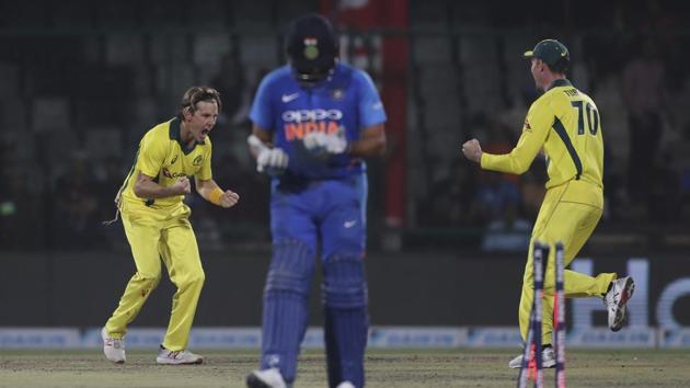 Australia's Adam Zampa, left, celebrates the wicket of India's Rohit Sharma.(AP) Australia's Adam Zampa, left, celebrates the wicket of India's Rohit Sharma.(AP)