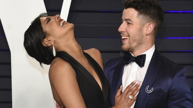 Priyanka Chopra, left, and Nick Jonas arrive at the Vanity Fair Oscar Party.(Evan Agostini/Invision/AP)