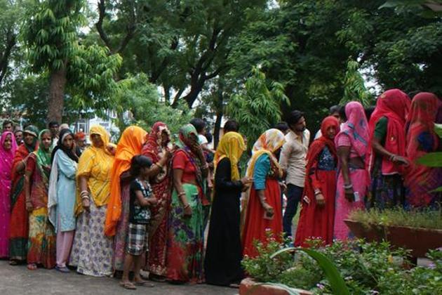 Rajasthan, India – August 17, 2015: Women voters wait to cast their votes during Municipal Corporation polls at a polling booth of Chomu, in Jaipur, Rajasthan, India on Monday, August 17, 2015.(Prabhakar Sharma/ Hindustan Times)