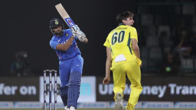 India's Rohit Sharma plays a shot as Australia's Jhye Richardson looks on. (AP)