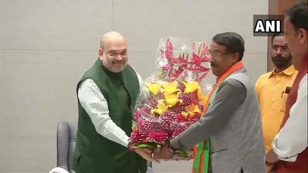 Congress leader Tom Vadakkan, who joined the BJP in New Delhi on Thursday, with BJP president Amit Shah .(ANI photo)
