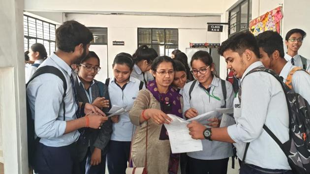Students of CMS Aliganj-I discussing ICSE economics paper in Lucknow on Friday (HT) Students of CMS Aliganj-I discussing ICSE economics paper in Lucknow on Friday (HT)