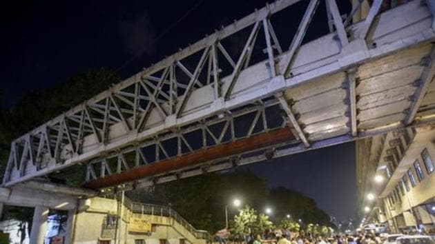 A major section of the crowded bridge, known to locals as the Himalaya bridge, came crashing down during evening rush hour on Thursday.(Kunal Patil/HT Photo) A major section of the crowded bridge, known to locals as the Himalaya bridge, came crashing down during evening rush hour on Thursday.(Kunal Patil/HT Photo)