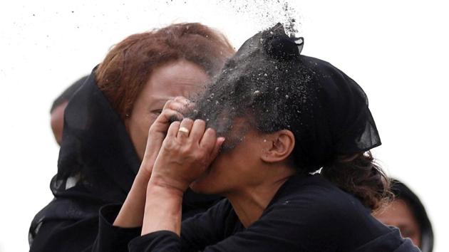 A relative puts soil on her face as she mourns at the scene of the Ethiopian Airlines Flight ET 302 plane crash, near the town Bishoftu, near Addis Ababa, Ethiopia. (Tiksa Negeri / REUTERS) A relative puts soil on her face as she mourns at the scene of the Ethiopian Airlines Flight ET 302 plane crash, near the town Bishoftu, near Addis Ababa, Ethiopia. (Tiksa Negeri / REUTERS)