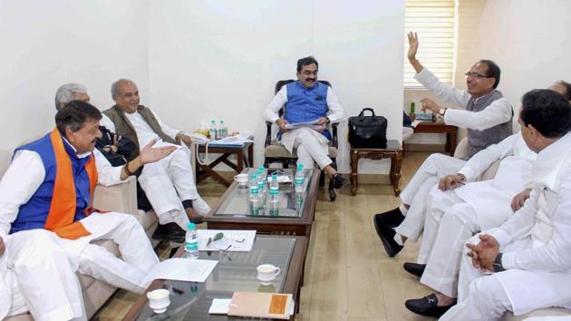 BJP State President Rakesh Singh (C), BJP National Vice President and former chief minister Shivraj Singh Chouhan (3rdR) and party leaders during a meeting, at BJP State headquarters in Bhopal. The BJP is mulling axing over 12 sitting MPs for the April-May Lok Sabha polls to tide over anti-incumbency, a party leader told news agency PTI on condition of anonymity. (PTI) BJP State President Rakesh Singh (C), BJP National Vice President and former chief minister Shivraj Singh Chouhan (3rdR) and party leaders during a meeting, at BJP State headquarters in Bhopal. The BJP is mulling axing over 12 sitting MPs for the April-May Lok Sabha polls to tide over anti-incumbency, a party leader told news agency PTI on condition of anonymity. (PTI)