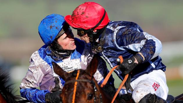 Harry Skelton on Roksana kisses P J Brennan on Cap Soleil after winning the 4:10 OLBG Mares’ Hurdle (Grade 1) (Registered As The David Nicholson Mares’ Hurdle) during the Cheltenham Festival at Cheltenham Racecourse, in England. (Eddie Keogh / REUTERS) Harry Skelton on Roksana kisses P J Brennan on Cap Soleil after winning the 4:10 OLBG Mares’ Hurdle (Grade 1) (Registered As The David Nicholson Mares’ Hurdle) during the Cheltenham Festival at Cheltenham Racecourse, in England. (Eddie Keogh / REUTERS)
