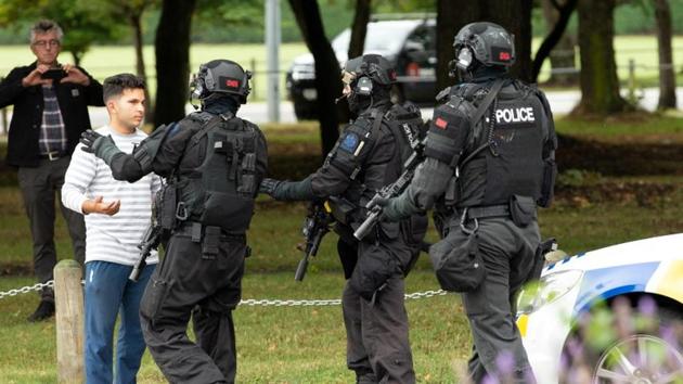 AOS (Armed Offenders Squad) push back members of the public following a shooting at the Masjid Al Noor mosque in Christchurch, New Zealand.(Reuters Photo) AOS (Armed Offenders Squad) push back members of the public following a shooting at the Masjid Al Noor mosque in Christchurch, New Zealand.(Reuters Photo)