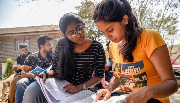 Students prepare for examination at Karve Institute of Social Services, Karvenagar, on Thursday.(Sanket Wankhade/HT PHOTO)