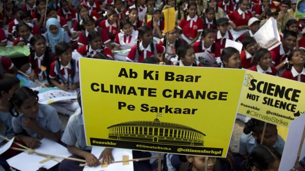 Indian students hold placards and participate in a climate protest in Hyderabad, March 15, 2019. Students in more than 80 countries and territories worldwide skipped class in protest over their governments' failure to act against global warming.(AP)