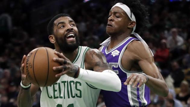 Boston Celtics guard Kyrie Irving (11) drives against Sacramento Kings guard De'Aaron Fox.(AP) Boston Celtics guard Kyrie Irving (11) drives against Sacramento Kings guard De'Aaron Fox.(AP)