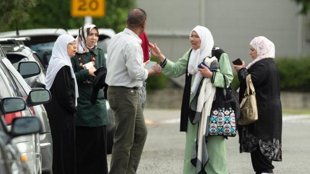Members of a family react outside the Al Noor mosque.Police ave said one person is in custody but they were not sure if others were involved, and people should stay away from mosques. “Police are responding with its full capability to manage the situation, but the risk environment remains extremely high,” New Zealand’s Police Commissioner Mike Bush said. (Martin Hunter / SNPA / REUTERS) Members of a family react outside the Al Noor mosque.Police ave said one person is in custody but they were not sure if others were involved, and people should stay away from mosques. “Police are responding with its full capability to manage the situation, but the risk environment remains extremely high,” New Zealand’s Police Commissioner Mike Bush said. (Martin Hunter / SNPA / REUTERS)