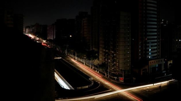 Car lights are seen on one of the main roads of the city during the second day of a blackout in Caracas, Venezuela. (Carlos Jasso / REUTERS) Car lights are seen on one of the main roads of the city during the second day of a blackout in Caracas, Venezuela. (Carlos Jasso / REUTERS)
