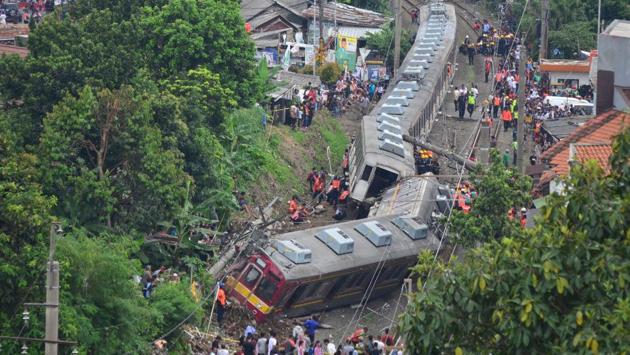 An Indonesian search and rescue team examine a train after it derailed in Bogor. Several people were injured and no fatalities were reported in the accident. (Dwi Susanto / AFP) An Indonesian search and rescue team examine a train after it derailed in Bogor. Several people were injured and no fatalities were reported in the accident. (Dwi Susanto / AFP)