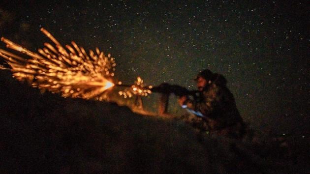 A fighter with the Syrian Democratic Forces (SDF) fires a machine gun in a position in the eastern Syrian province of Deir Ezzor outside the Islamic State group’s embattled holdout of Baghouz. (Bulent Kilic / AFP) A fighter with the Syrian Democratic Forces (SDF) fires a machine gun in a position in the eastern Syrian province of Deir Ezzor outside the Islamic State group’s embattled holdout of Baghouz. (Bulent Kilic / AFP)
