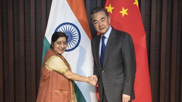 A file photo of Xinhua News Agency, shows Chinese Foreign Minister Wang Yi, right, shakes hands with his Indian counterpart Sushma Swaraj at a meeting in Wuzhen Town, east China's Zhejiang Province. (AP) A file photo of Xinhua News Agency, shows Chinese Foreign Minister Wang Yi, right, shakes hands with his Indian counterpart Sushma Swaraj at a meeting in Wuzhen Town, east China's Zhejiang Province. (AP)