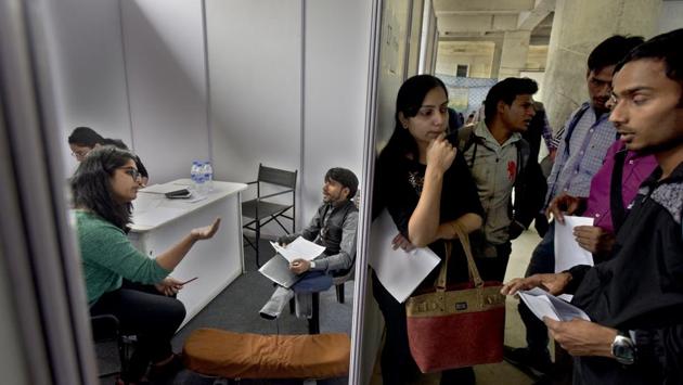 Specially-abled candidates wait for their interview during a Job Fair by Blind Relief Association at Lal Bahadur Shashtri Marg, in New Delhi. (Sushil Kumar / HT Photo) 