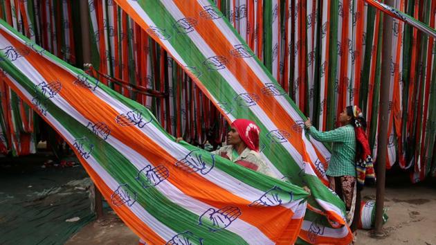 A worker pulls a roll of flags of India's main opposition Congress party kept for drying at a flag manufacturing factory, ahead of the 2019 general elections, in Ahmedabad, Gujarat. (Amit Dave / REUTERS) 