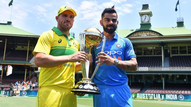 Virat Kohli and Aaron Finch pose with the ICC Cricket World Cup trophy. (AFP) Virat Kohli and Aaron Finch pose with the ICC Cricket World Cup trophy. (AFP)