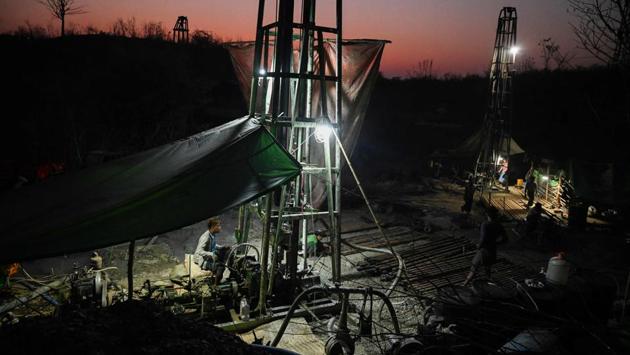 Workers operate machines to extract crude oil from a well. A pulley at the top of each well supports a drill that can plunge more than a kilometre into the ground. Each is manned by a team working round-the-clock, often caked in black, viscous grime as they wait for a potentially lucrative spurt of oil. (Ye Aung Thu / AFP) Workers operate machines to extract crude oil from a well. A pulley at the top of each well supports a drill that can plunge more than a kilometre into the ground. Each is manned by a team working round-the-clock, often caked in black, viscous grime as they wait for a potentially lucrative spurt of oil. (Ye Aung Thu / AFP)