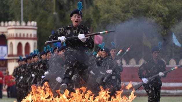 A woman personnel of the 23rd battalion of Madhya Pradesh Special Armed Force (SAF) jumps a hurdle during a silent drill demonstration, at Motilal Nehru Police Stadium, in Bhopal, Madhya Pradesh. (Mujeeb Faruqui / HT Photo) 