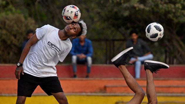Boys practice free style football skills in a public park at Bandra Kurla Complex in Mumbai, Maharshtra. (Satyabrata Tripathy / HT Photo) 