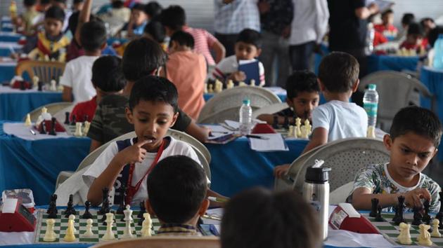 Players in action on the second day of Maharashtra state selection under-7 chess championship played at Khed Shivapur on Saturday.(Pratham Gokhale/HT Photo)