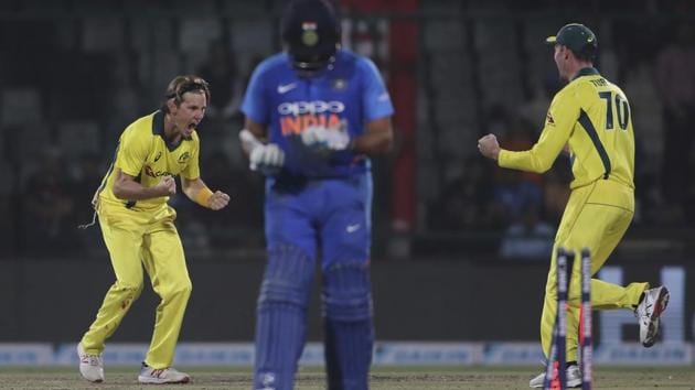 Australia's Adam Zampa, left, celebrates the wicket of India's Rohit Sharma.(AP)