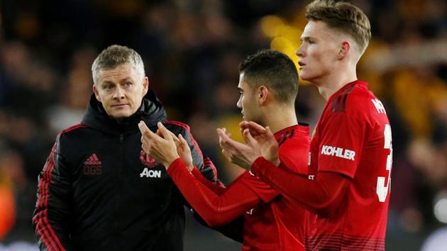 Manchester United interim manager Ole Gunnar Solskjaer looks dejected after the match with Scott McTominay and Andreas Pereira.(REUTERS)