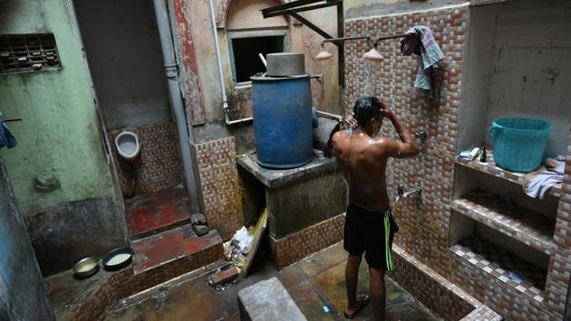 Bathing at Raghunath Residency. “The Messbari Project is a wonderful initiative and I will help take it forward in my capacity,” said Bhattacharjee. Realising that there were many stories to be told, HWC launched an internship project to study messbaris. Armed with literary references, anecdotes and street directories dating back to 1915, interns began cataloguing the structures, and uncovering historical references. (Arijit Sen / HT Photo) Bathing at Raghunath Residency. “The Messbari Project is a wonderful initiative and I will help take it forward in my capacity,” said Bhattacharjee. Realising that there were many stories to be told, HWC launched an internship project to study messbaris. Armed with literary references, anecdotes and street directories dating back to 1915, interns began cataloguing the structures, and uncovering historical references. (Arijit Sen / HT Photo)