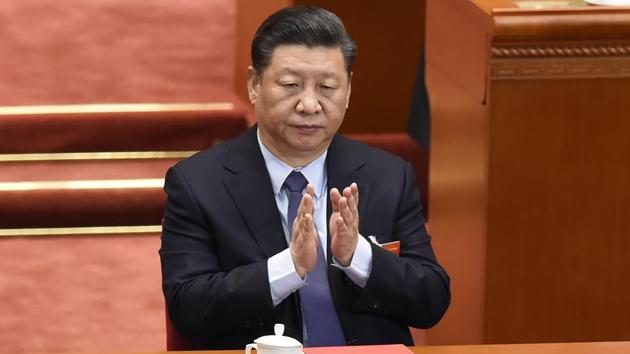 China's President Xi Jinping applauds during the closing session of the National People's Congress (NPC) in Beijing's Great Hall of the People on March 15, 2019.(AFP photo)